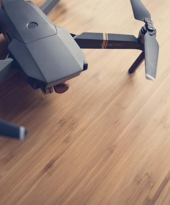 These are some drone phots that are hovering in the air and 1st one is set on the table.